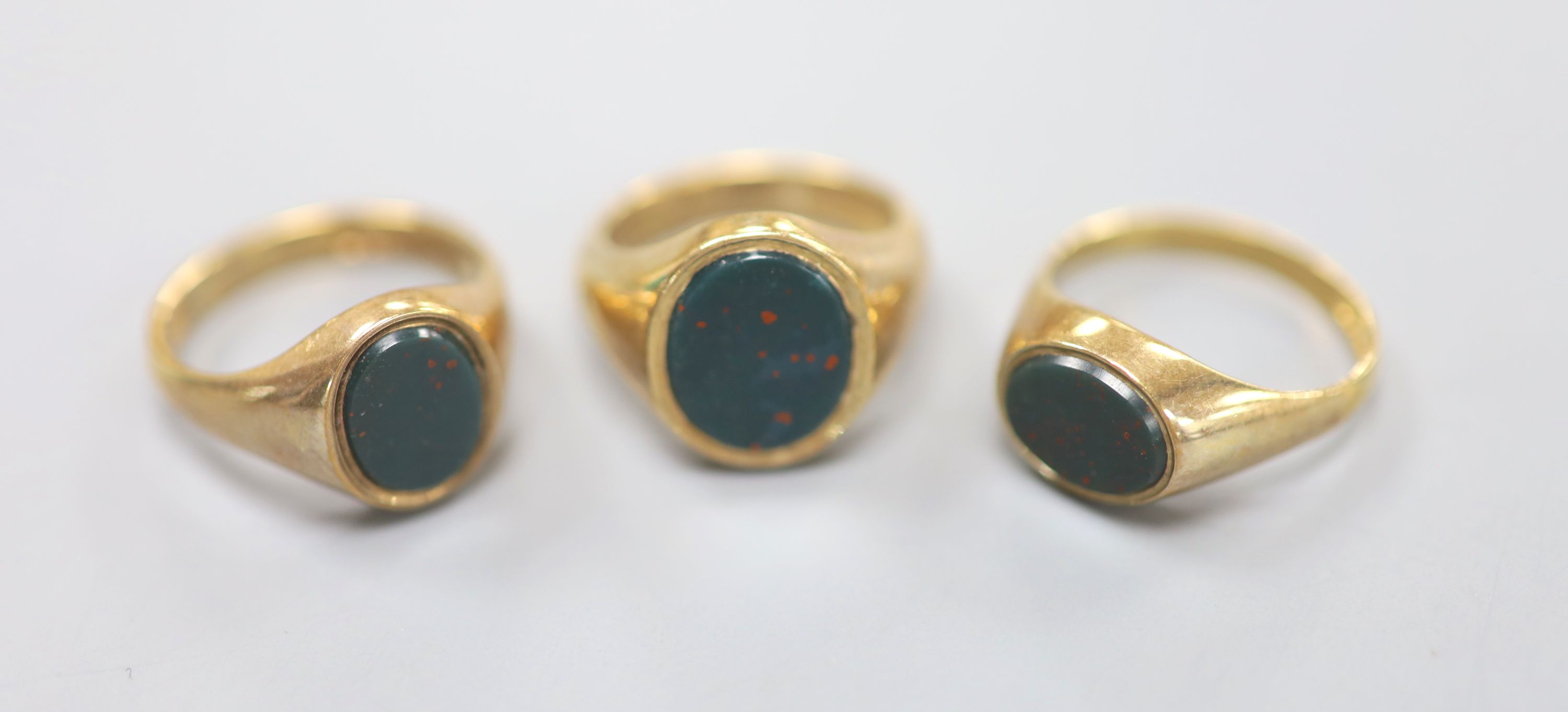 Three assorted modern 9ct gold and bloodstone set signet rings, sizes J,N, & O